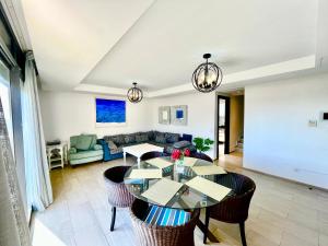 a living room with a table and chairs at Atlantic View Duplex Tawenza Bay in Taghazout
