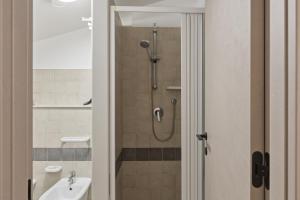 a bathroom with a shower and a sink at Case Vacanze Celeste in Marzamemi +22 photos
