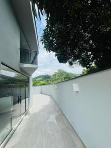 a view from the outside of a white building at Pousada Vila Palmital in Paraty