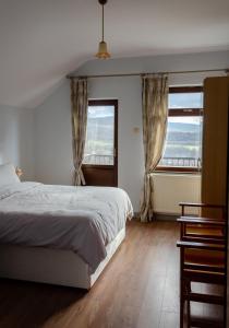 a bedroom with a bed and a large window at Villa “Nadezhda” in Tsareva Livada +60 photos