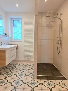 a bathroom with a shower and a sink at Haus Lieberum in Bad Sooden-Allendorf +91 photos