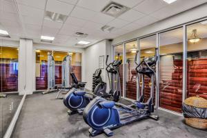 a gym with treadmills and elliptical machines at Daytona Beach Resort 533- Oceanfront Oasis in Daytona Beach