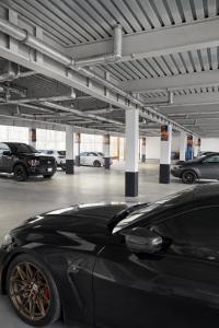 a black car parked in a parking lot at Cabana Hotel Yankee Stadium in Bronx