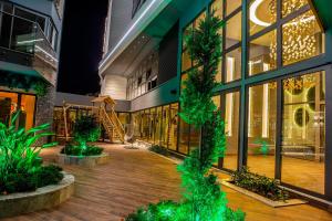 a building with trees in the middle of a courtyard at SA Apartments! Cleopatra Beach Duplex with Terrace in Alanya