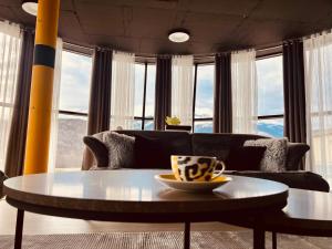 a coffee table in a living room with a couch at L&A Apartments in Dragash