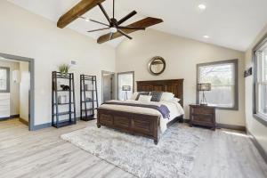 a bedroom with a bed and a ceiling fan at Outdoor Wonderland! Home 12 Mi to Lake George in Fort Ann