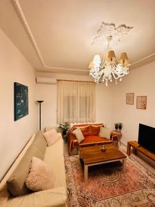 a living room with a couch and a table at Dryrivers house in Xiropótamos