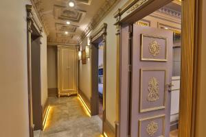 a hallway with a door in a building at REAL KiNG SUiTE in Trabzon +48 photos