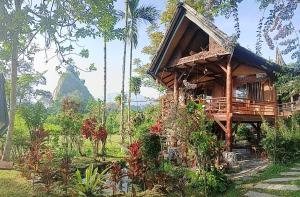 a wooden house in the middle of a forest at SUMATRA ECORESORT in Bukittinggi