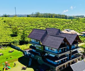 an overhead view of a house with a roof at Queens Lake Cabin in Nuwara Eliya