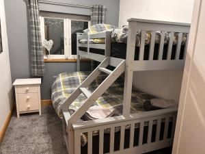 a bedroom with two bunk beds and a window at Forest view in Staunton