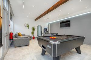 a living room with a pool table in it at Hambleton House in Derby