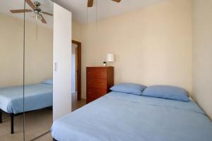 a bedroom with a bed and a dresser and a mirror at Dimora del Sole in Vasto