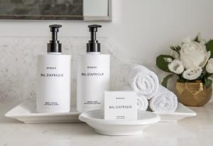 two bottles ofodorizers sitting on a counter with towels at InterContinental Chicago Magnificent Mile by IHG in Chicago +124 photos