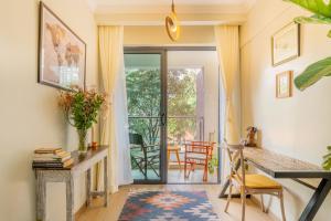 a home office with a desk and a table at Kikao-Marina Bay in Nairobi