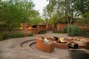 a patio with couches and a fire pit at Awasi Atacama in San Pedro de Atacama