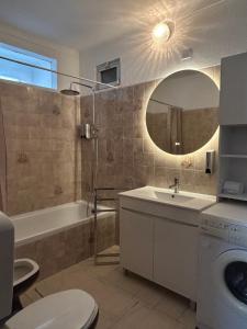 a bathroom with a sink and a toilet and a mirror at Refúgio da Azinheira in Torrão +7 photos