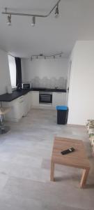 a living room with a couch and a coffee table at Studio sans chambre 2 personnes in Arsac-en-Velay