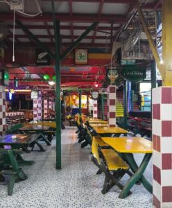 an empty restaurant with tables and chairs in it at Reggaein in Phi Phi Islands