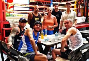 a group of people posing for a picture at a table at Reggaein in Phi Phi Islands +16 photos