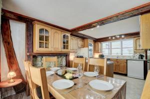 a kitchen with a table with plates on it at 4 Bed in Looe oc-l30047 in Looe