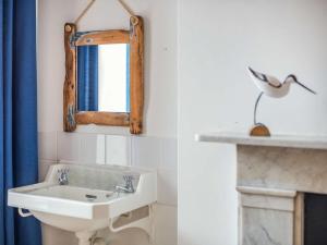 a bathroom with a sink and a mirror at 5 Bed in Swanage oc-dc060 in Swanage +20 photos