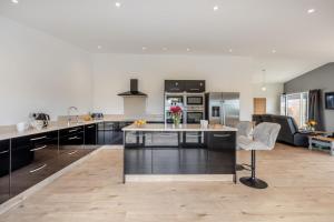 a kitchen with a large island in the middle at 2 Bed in Somerton oc-s32606 in Somerton