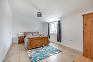 a bedroom with a bed and a window and a rug at 2 Bed in Somerton oc-s32606 in Somerton