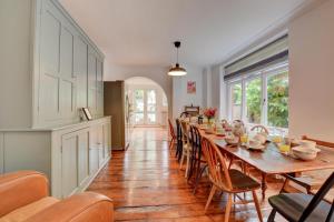 a dining room with a long table and chairs at 6 Bed in Cromer oc-1996 in Cromer
