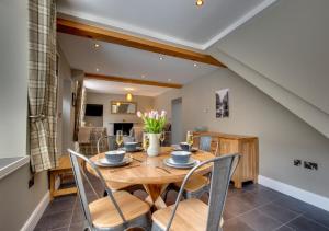 a dining room with a wooden table and chairs at 2 Bed in Hawes oc-ds937 in Hawes