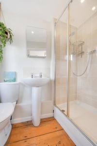 a bathroom with a sink and a shower at 3 Bed in St. Ives oc-marhou in St Ives +13 photos