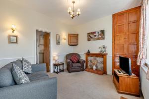 a living room with a couch and a television at 2 Bed in Ingleton oc-w31066 in Ingleton