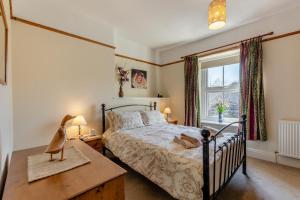 a bedroom with a bed and a window at 2 Bed in Ingleton oc-w31066 in Ingleton