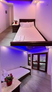 a large bed in a room with purple lighting at Skybloom Farm Resort in Balasic