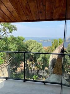 a room with a large window with a view at Capri Hills in Mwanza