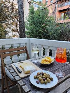 a table with plates of food and glasses of wine at Lacasabianca guest house saronno in Saronno