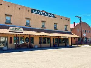 a large building with a sign on top of it at La Veta Inn in La Veta