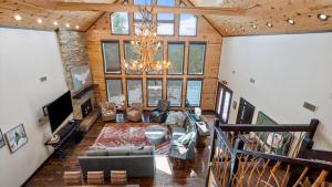 an overhead view of a living room with a chandelier at New Unbelievable Views Gourmet Kitchen Firepit in Broken Bow