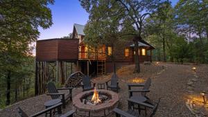 a fire pit in front of a house at New Unbelievable Views Gourmet Kitchen Firepit in Broken Bow +29 photos