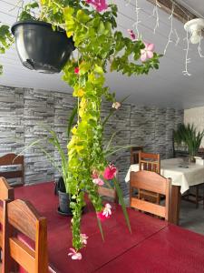 a table with a bunch of flowers on top of it at Hotel ph in Barcarena