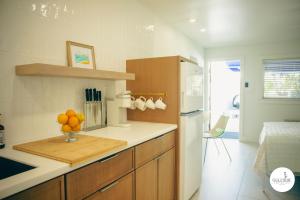 a kitchen with a bowl of oranges on a counter at Gulfside Resort. Unit 6 in St. Pete Beach +21 photos