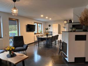 a living room with a kitchen and a dining room at KIWE5 in Plauen