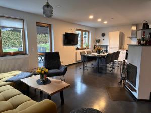 a living room with a couch and a table at KIWE5 in Plauen