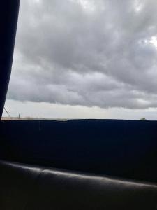 a view of the ocean from a car window at Jim3 moterno studio fast wi-fi with a view in Andravída