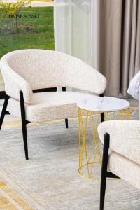 a living room with a couch and a table at Olifile Boutique Hotel & Restaurant in Midrand