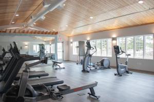 a gym with treadmills and ellipticals in a room at Staybridge Suites Fargo by IHG in Fargo