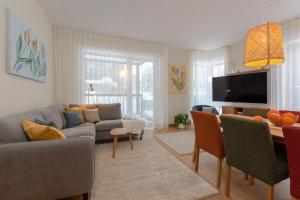 a living room with a couch and a table at Pargi 21 Apartments in Tartu