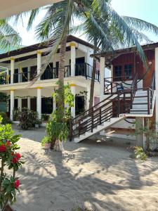 a house with a staircase in front of it at Terra Tipi in Guayabas