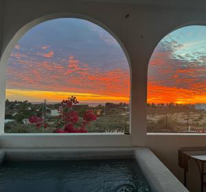 a bath tub with a view of a sunset at SEA Villa With Private Plunge Pool in Todos Santos