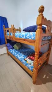 two sets of bunk beds in a room at PREMIUM Puerto Varadero Apartamento con Vista al Mar y Planta Total in Tucacas +44 photos
